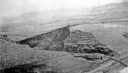 Long-distance view of upstream face of Dale Dyke Dam after its breach